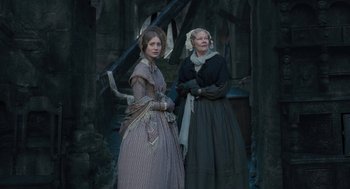 Movie still from “Jane Eyre” (2011), directed by Cary Joji Fukunaga – Two women dressed in period clothing standing next to each other; Wide shot, High angle