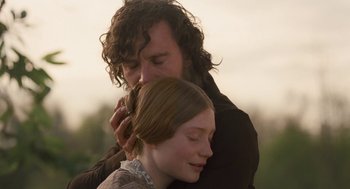 Movie still from “Jane Eyre” (2011), directed by Cary Joji Fukunaga – A man and a woman embracing each other in a field; Close Up shot, Over the shoulder angle