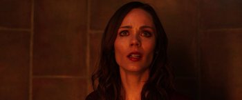 Movie still from “Jigsaw” (2017), directed by Michael Spierig – A person with long dark hair; Close Up shot, Over the shoulder angle