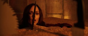 Movie still from “Jigsaw” (2017), directed by Michael Spierig – A person laying on the ground; Close Up shot, Overhead angle