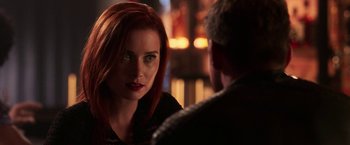 Movie still from “Jigsaw” (2017), directed by Michael Spierig – A woman with red hair is looking at a man with a beard; Close Up shot, Over the shoulder angle