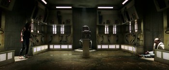 Movie still from “Jigsaw” (2017), directed by Michael Spierig – An electric hair dryer in the middle of a room; Wide shot, High angle