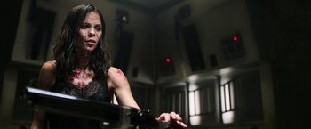 Movie still from “Jigsaw” (2017), directed by Michael Spierig – A woman with a red spot on her arm; Close Up shot, Low angle