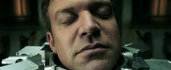 Movie still from “Jigsaw” (2017), directed by Michael Spierig – A person with his eyes closed; Close Up shot, Overhead angle