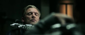 Movie still from “Jigsaw” (2017), directed by Michael Spierig – A person taking a picture with a camera; Close Up shot, Low angle