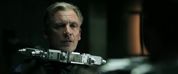 Movie still from “Jigsaw” (2017), directed by Michael Spierig – A person holding a camera; Close Up shot, Low angle