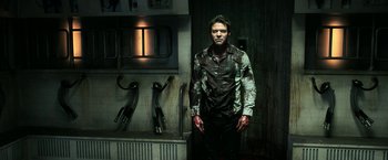 Movie still from “Jigsaw” (2017), directed by Michael Spierig – A man with blood all over his face and chest; Medium shot, Overhead angle