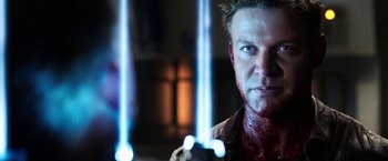 Movie still from “Jigsaw” (2017), directed by Michael Spierig – A person holding a cell phone; Close Up shot, Over the shoulder angle