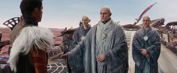 Movie still from “John Carter” (2012), directed by Andrew Stanton – Two bald men standing next to each other; Medium shot, Low angle