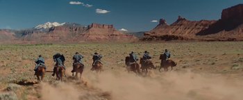 Movie still from “John Carter” (2012), directed by Andrew Stanton – A group of men riding horses through the desert; Extreme Wide shot, Low angle