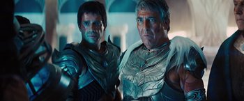 Movie still from “John Carter” (2012), directed by Andrew Stanton – A couple of men standing next to each other; Medium shot, Over the shoulder angle