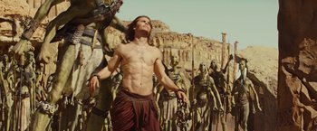 Movie still from “John Carter” (2012), directed by Andrew Stanton – A group of men standing next to each other; Wide shot, Low angle
