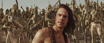 Movie still from “John Carter” (2012), directed by Andrew Stanton – A man in the middle of a group of people; Medium shot, Low angle