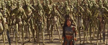 Movie still from “John Carter” (2012), directed by Andrew Stanton – A woman standing in front of a group of people; Wide shot, High angle