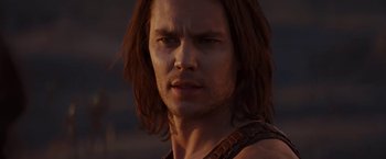 Movie still from “John Carter” (2012), directed by Andrew Stanton – A person with long brown hair; Close Up shot, Low angle