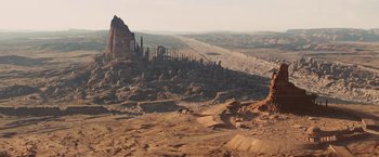 Movie still from “John Carter” (2012), directed by Andrew Stanton – A view of a desert landscape from the top of a hill; Extreme Wide shot, High angle