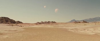 Movie still from “John Carter” (2012), directed by Andrew Stanton – A desert landscape with mountains in the background; Extreme Wide shot, High angle
