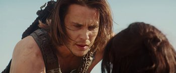 Movie still from “John Carter” (2012), directed by Andrew Stanton – A person with long brown hair; Close Up shot, Over the shoulder angle