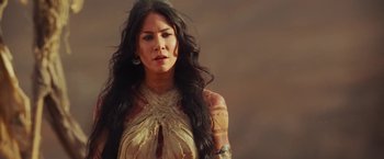 Movie still from “John Carter” (2012), directed by Andrew Stanton – A woman with long black hair wearing a white dress; Close Up shot, Over the shoulder angle