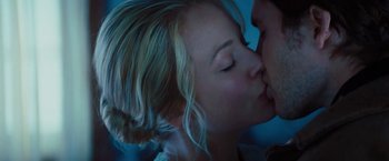 Movie still from “John Carter” (2012), directed by Andrew Stanton – A person kissing another person on the cheek; Close Up shot, Over the shoulder angle