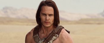Movie still from “John Carter” (2012), directed by Andrew Stanton – A person with long brown hair; Close Up shot, Over the shoulder angle