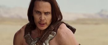 Movie still from “John Carter” (2012), directed by Andrew Stanton – A person with long brown hair; Close Up shot, Low angle