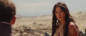 Movie still from “John Carter” (2012), directed by Andrew Stanton – A woman standing in the desert looking at the camera; Close Up shot, Over the shoulder angle