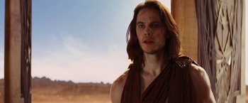 Movie still from “John Carter” (2012), directed by Andrew Stanton – A person with long brown hair; Close Up shot, Over the shoulder angle