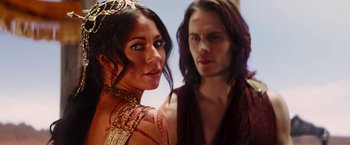 Movie still from “John Carter” (2012), directed by Andrew Stanton – A man and a woman standing next to each other; Close Up shot, Over the shoulder angle