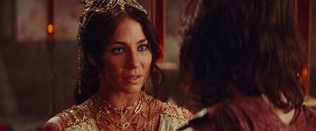 Movie still from “John Carter” (2012), directed by Andrew Stanton – A woman with blue eyes wearing a gold crown; Close Up shot, Over the shoulder angle