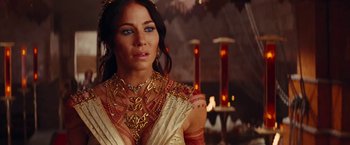 Movie still from “John Carter” (2012), directed by Andrew Stanton – A woman wearing a gold necklace and a gold dress; Close Up shot, Over the shoulder angle