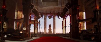 Movie still from “John Carter” (2012), directed by Andrew Stanton – A woman in a white dress standing in front of a red carpet; Wide shot, Low angle