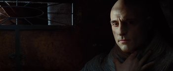 Movie still from “John Carter” (2012), directed by Andrew Stanton – A man with a bald head is posing for a picture; Close Up shot, Low angle