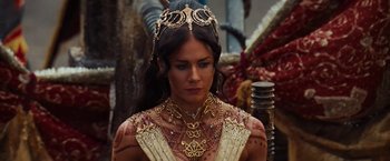 Movie still from “John Carter” (2012), directed by Andrew Stanton – A woman in a gold crown and necklace; Close Up shot, High angle