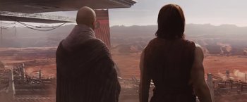 Movie still from “John Carter” (2012), directed by Andrew Stanton – A man and a woman looking out of a window; Wide shot, Over the shoulder angle