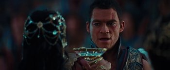 Movie still from “John Carter” (2012), directed by Andrew Stanton – A person holding a cup; Close Up shot, Over the shoulder angle
