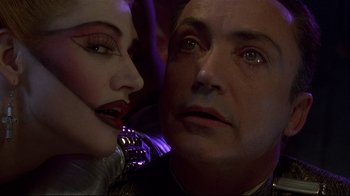 Movie still from “Johnny Mnemonic” (1995), directed by Robert Longo – A man and a woman looking into each other's eyes; Close Up shot, Over the shoulder angle