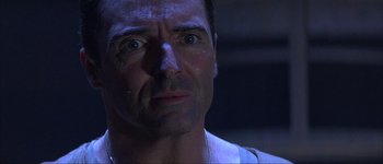 Movie still from “Judge Dredd” (1995), directed by Danny Cannon – A man's face in the dark; Close Up shot, Low angle