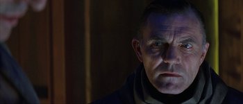 Movie still from “Judge Dredd” (1995), directed by Danny Cannon – A person wearing a black jacket; Close Up shot, Low angle