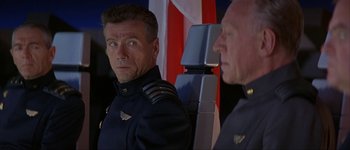 Movie still from “Judge Dredd” (1995), directed by Danny Cannon – A man in a military uniform looking at the camera; Close Up shot, Low angle