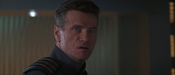 Movie still from “Judge Dredd” (1995), directed by Danny Cannon – A person wearing a uniform; Close Up shot, Low angle