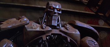 Movie still from “Judge Dredd” (1995), directed by Danny Cannon – The head of a robot; Close Up shot, Low angle