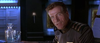 Movie still from “Judge Dredd” (1995), directed by Danny Cannon – A person wearing a uniform; Close Up shot, Low angle