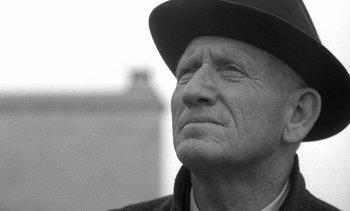 Movie still from “Judgment at Nuremberg” (1961), directed by Stanley Kramer – An older man wearing a hat looking upward; Close Up shot, Low angle