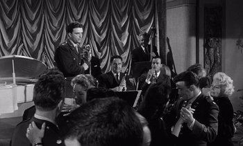 Movie still from “Judgment at Nuremberg” (1961), directed by Stanley Kramer – A black and white photo of a group of people; Medium shot, Low angle