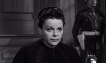 Movie still from “Judgment at Nuremberg” (1961), directed by Stanley Kramer – An old black and white photo of a woman; Close Up shot, High angle