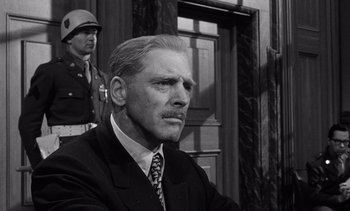 Movie still from “Judgment at Nuremberg” (1961), directed by Stanley Kramer – An older man wearing a suit and tie; Close Up shot, Low angle