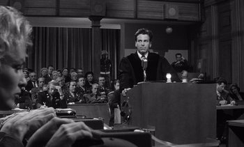 Movie still from “Judgment at Nuremberg” (1961), directed by Stanley Kramer – A black and white photo of a man giving a speech; Medium shot, Low angle