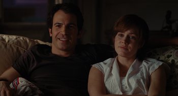 Movie still from “Julie & Julia” (2009), directed by Nora Ephron – A man and a woman sitting next to each other; Medium shot, Over the shoulder angle
