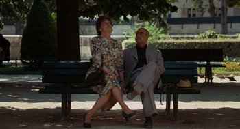 Movie still from “Julie & Julia” (2009), directed by Nora Ephron – An older couple sitting on a park bench; Wide shot, High angle